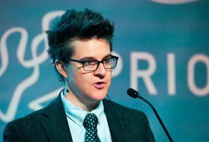 Erica Chenoweth speaking at a conference podium