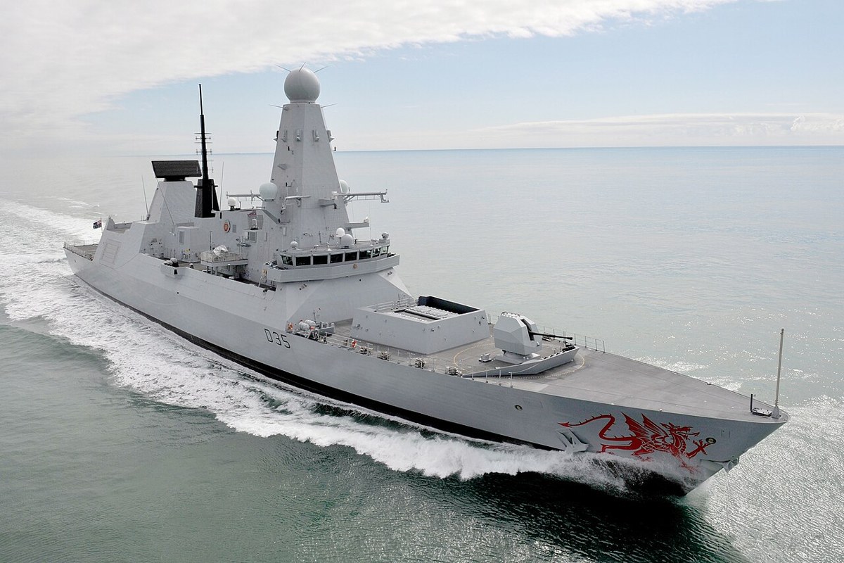 Royal Navy Type 45 destroyer HMS Dragon cutting through the sea at speed
