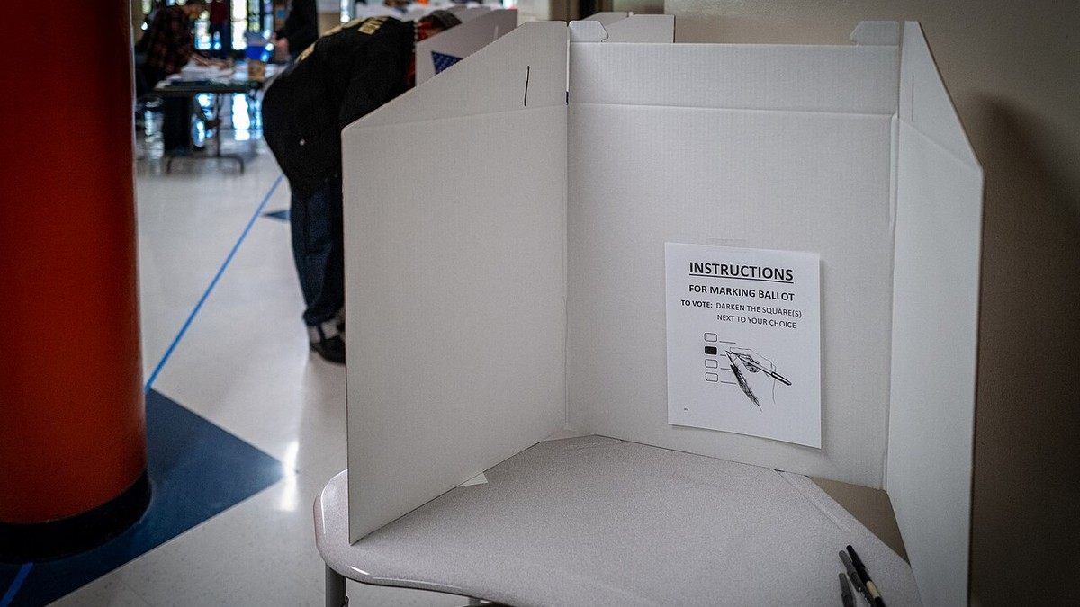Voters at a ballot-marking booth at a polling place